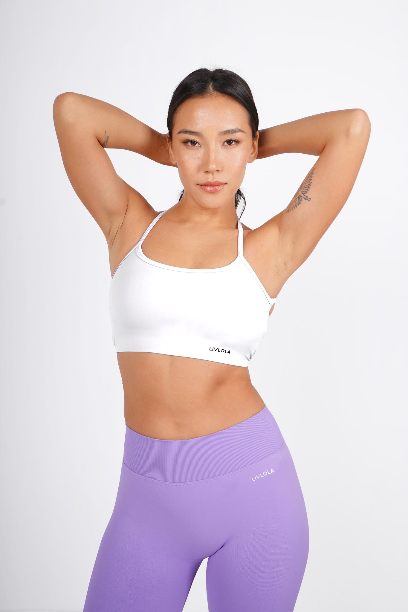 Fitness hipster girl in fashion sportswear doing yoga fitness